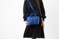 Women& x27;s dark blue leather bag in vintage style, black lock, front view. The trendy purse office, business trips or Royalty Free Stock Photo