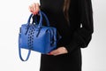 Women& x27;s dark blue leather bag in vintage style, black lock, front view. The trendy purse office, business trips or Royalty Free Stock Photo