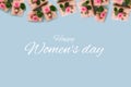 Women`s day banner.postcard favorite.Festive wreath of roses decoration with gifts and pink roses on a blue background. copyspace Royalty Free Stock Photo