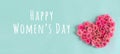 Women`s day banner.postcard favorite.Festive wreath of roses decoration with gifts and pink roses on a blue background Royalty Free Stock Photo