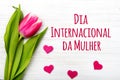 Women`s day card with Portuguese words `dia internacional da mulher`. Royalty Free Stock Photo