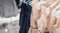 Women`s dresses on hangers in a clothing store Royalty Free Stock Photo