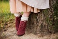 Women`s feet in red boots with lace socks Royalty Free Stock Photo