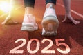 Women's feet on the road, run, the beginning of the New Year 2025