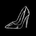 Women`s feet shod in high-heeled shoes