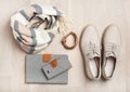 Women`s flat lay clothes shoes, scarf, bracelet, bag, tablet, sm Royalty Free Stock Photo