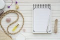 Women`s flatlay with notebook, handbag, cosmetics, cristall and minerals. Royalty Free Stock Photo