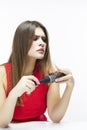 Women`s Hairloss Issues. Unpleased Caucasian Female Having Hair Problems. Checking Hair in Hairbrush.