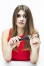 Women`s Hairloss Issues. Young Caucasian Female Having Hair Problems. Checking Hair in Hairbrush. Posing in Red Dress Against Royalty Free Stock Photo