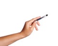 Women`s hand with cosmetic accessories: lip pen, eyeshadow brush