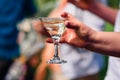 Women`s hand with a glass of Martini close-up Royalty Free Stock Photo