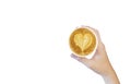 Women`s Hand holding cup of cappuccino coffee with heart shape latte art isolated on white background, Latte coffee on white Royalty Free Stock Photo