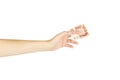 Women`s hand holds five thousand roubles on a white background. Royalty Free Stock Photo