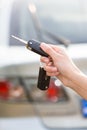 Women's hand presses on the remote control car alarm Royalty Free Stock Photo