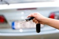 Women's hand presses on the remote control car alarm Royalty Free Stock Photo