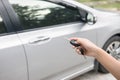 Women`s hand presses on the remote control car systems Royalty Free Stock Photo