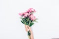 Women`s hand with trendy manicure holding bouquet of pink peonie Royalty Free Stock Photo