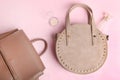 Women`s handbag, beige backpack and cosmetics Royalty Free Stock Photo