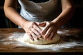 Women\'s hands in the bakery masterfully knead dough for delicious pastries