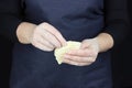 Women`s hands of the chef sculpt from the dough.