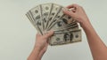 women hands count dollar bills spreading out a fan in front of them Royalty Free Stock Photo