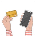 Women`s hands with a credit card and smartphone pay for purchases online. Credit card payment.