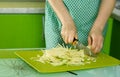 Women's hands cut the cabbage on green chalkboard Royalty Free Stock Photo