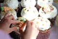 Women`s hands decorate a freshly baked Easter cake Royalty Free Stock Photo