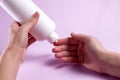 Women's hands with eczema apply the cream to the damaged skin of the hands. Treatment of dermatitis and eczema. Royalty Free Stock Photo