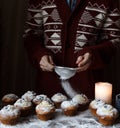 women's hands falling asleep powdered sugar cooked cupcakes. Royalty Free Stock Photo