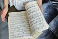 Women`s hands gently hold a music notebook, a romantic refined nature loves classical music