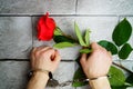 Women\'s hands in handcuffs on background gray brick wall. Idea limiting freedom in relationship. Rol Royalty Free Stock Photo