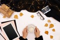 Women`s hands hold a cup of coffee, scarf on white background. Autumn or Winter concept. Flat lay, top view
