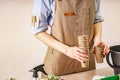 Women`s hands hold peat pots for plants. Process of preparation prepended seedlings for the new season. Unrecognizable person Royalty Free Stock Photo