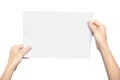 Women`s hands holding a blank sheet of paper