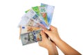 Women`s hands holding a money fan Royalty Free Stock Photo