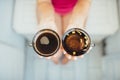 Women's hands holding tea and coffee Royalty Free Stock Photo