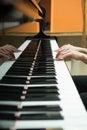 Women's hands on the keyboard of piano. girl plays Royalty Free Stock Photo