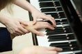 Women's hands on the keyboard of piano. girl plays Royalty Free Stock Photo