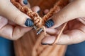 Women`s hands knit from color wool. Hand knitting