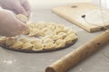 Women`s hands make dumplings Royalty Free Stock Photo