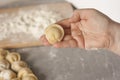Women`s hands make dumplings Royalty Free Stock Photo