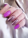 Women`s hands manicure silk fabric bright stylish glamour Royalty Free Stock Photo