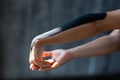 Women`s hands with a plaster glued from the elbow to the wrist for kinesitherapy and rehabilitation after injuries