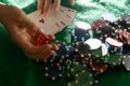 Women's hands shuffle cards. Concept of playing poker on the table with chips and cards. Gambling concept. Enjoying Royalty Free Stock Photo