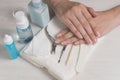 Women`s hands on a towel. Manicure. Manicure tools, nail Polish. Home nail care, SPA, beauty. Long natural nails. Beauty salon Royalty Free Stock Photo