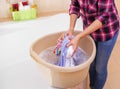 Women`s hands wash clothes in the basin. Royalty Free Stock Photo