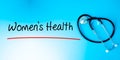 Women`s Health Sign.Text underline with red line. Isolated on blue background with stethoscope. Health concept