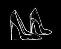 women`s high-heeled shoes painted in white on a black background Royalty Free Stock Photo