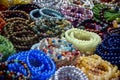 Women\'s Jewelry, small business. Handmade bracelets made of multi-colored beads on the counter of a street market